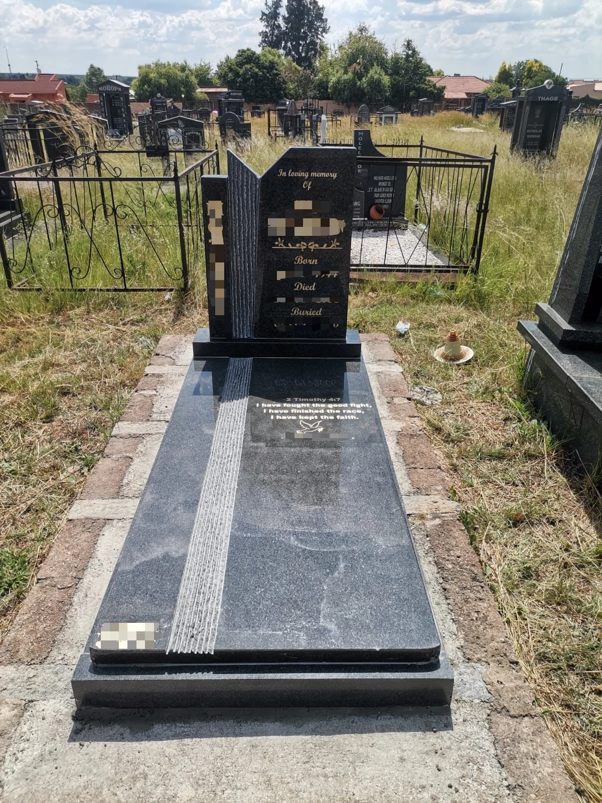 Elegant granite tombstone in a peaceful cemetery setting